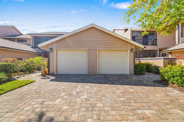 view of front of property featuring an outbuilding and a garage