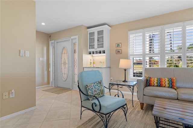 foyer featuring recessed lighting, baseboards, and light tile patterned floors