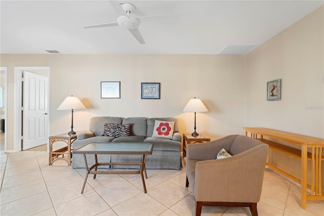 living room featuring light tile patterned flooring and ceiling fan