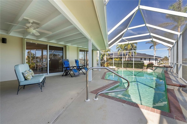 view of pool featuring ceiling fan, a lanai, and a patio