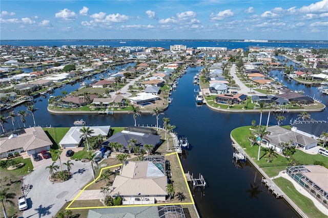 birds eye view of property with a residential view and a water view