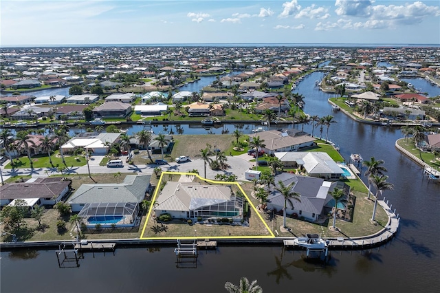 birds eye view of property featuring a water view and a residential view