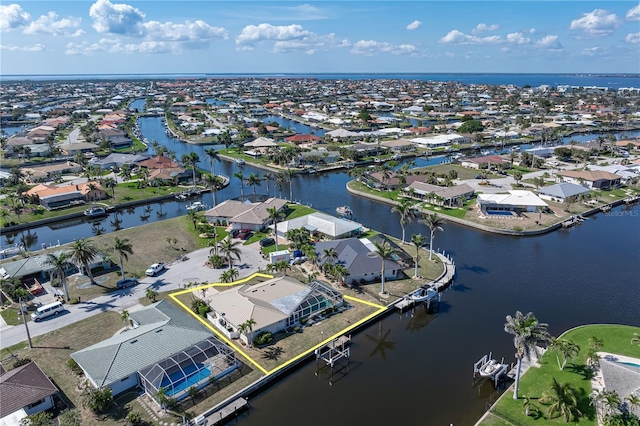 bird's eye view with a residential view and a water view