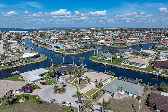 bird's eye view featuring a water view and a residential view