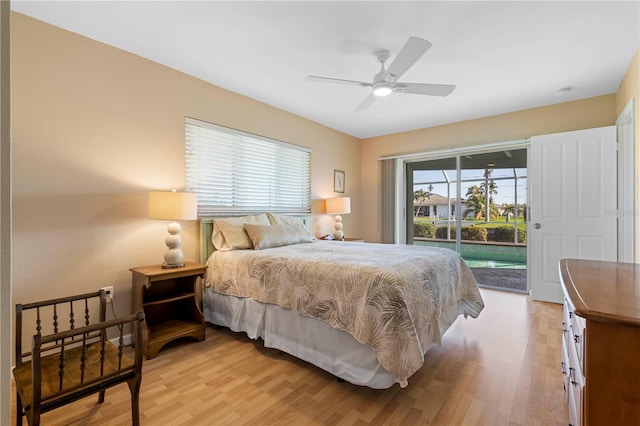 bedroom with access to outside, light wood-style flooring, and a ceiling fan