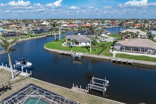 aerial view with a water view and a residential view