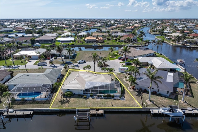 aerial view with a water view and a residential view