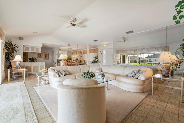 living room with vaulted ceiling and ceiling fan