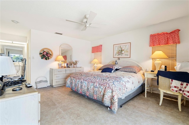 bedroom with light colored carpet and ceiling fan