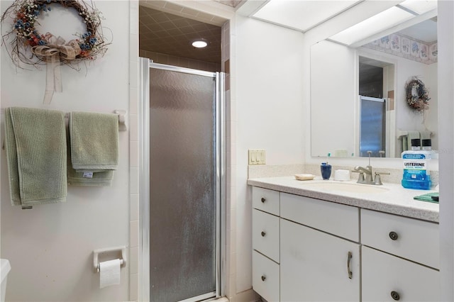 bathroom featuring vanity and an enclosed shower