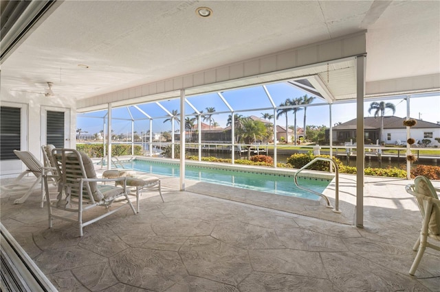 view of pool with a lanai and a patio