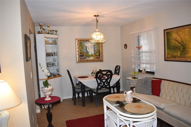 living room featuring light tile patterned floors and baseboards