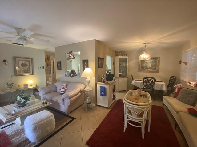 tiled living room featuring ceiling fan