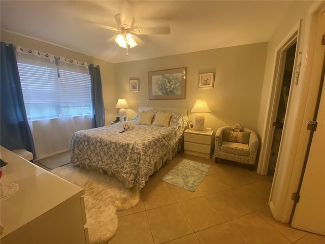 bedroom with light tile patterned floors and ceiling fan