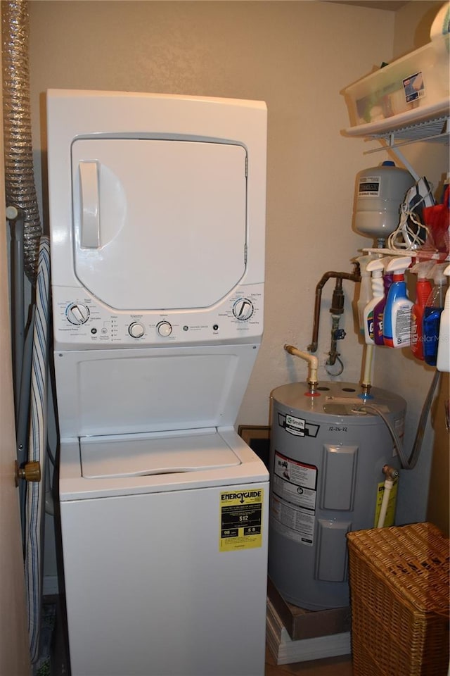 laundry area featuring stacked washer and dryer and water heater