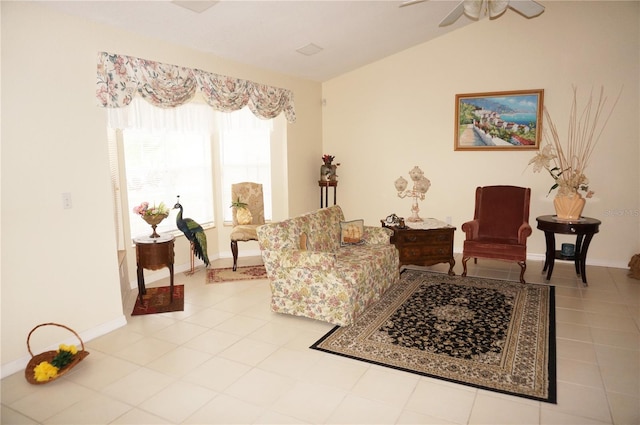 living room with ceiling fan and vaulted ceiling