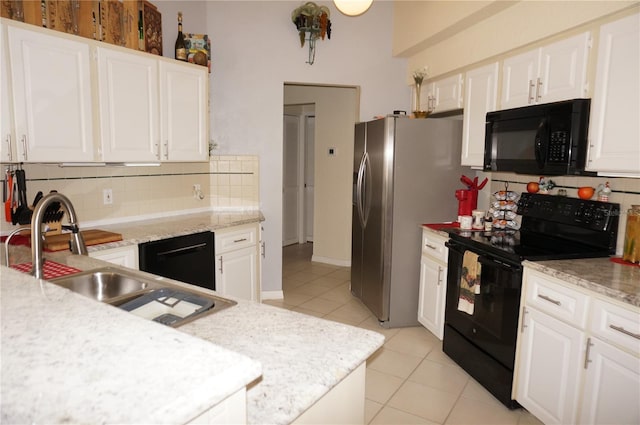 kitchen with white cabinetry, sink, and black appliances