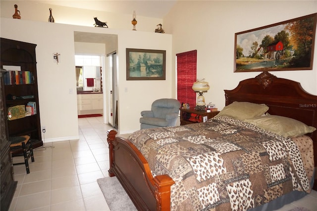 bedroom featuring connected bathroom and light tile patterned floors