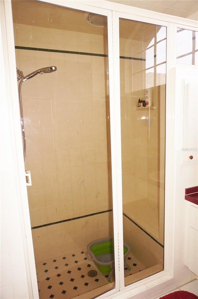 bathroom with a tile shower