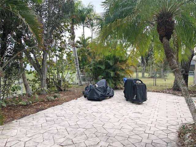 view of patio featuring a grill