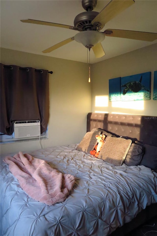 bedroom featuring cooling unit and ceiling fan