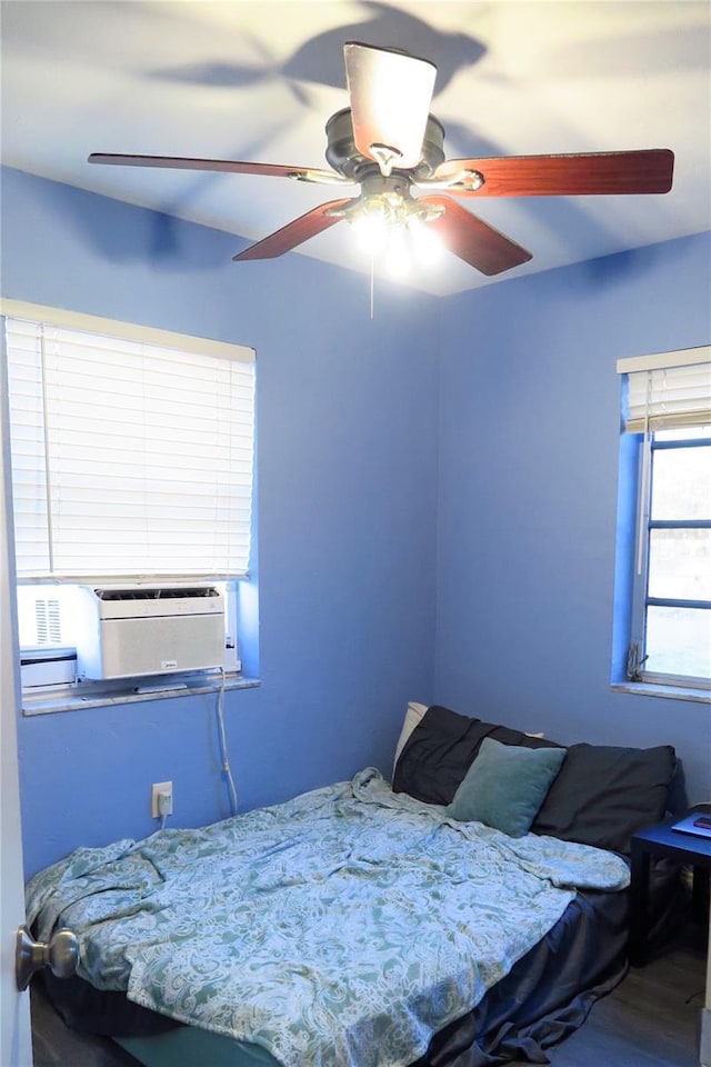 bedroom featuring hardwood / wood-style floors and ceiling fan