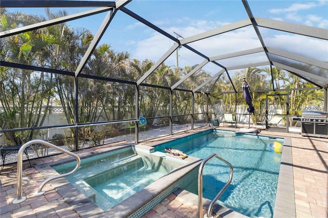 view of pool featuring an in ground hot tub, grilling area, a lanai, and a patio area