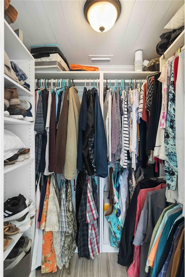 spacious closet featuring hardwood / wood-style floors