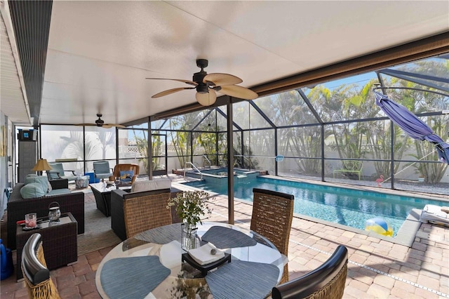 view of swimming pool featuring a patio, outdoor lounge area, and glass enclosure