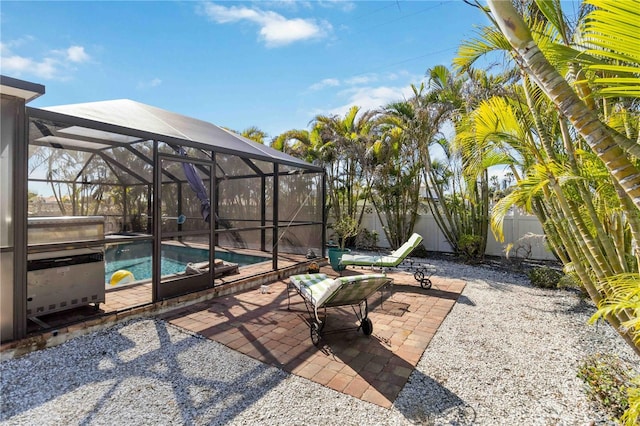 view of patio / terrace featuring glass enclosure