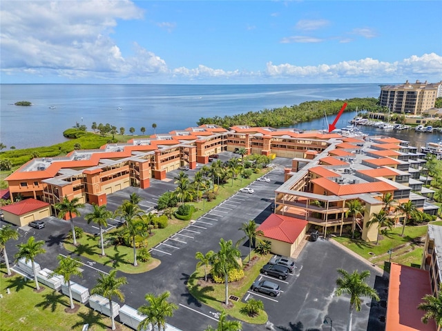 birds eye view of property featuring a water view