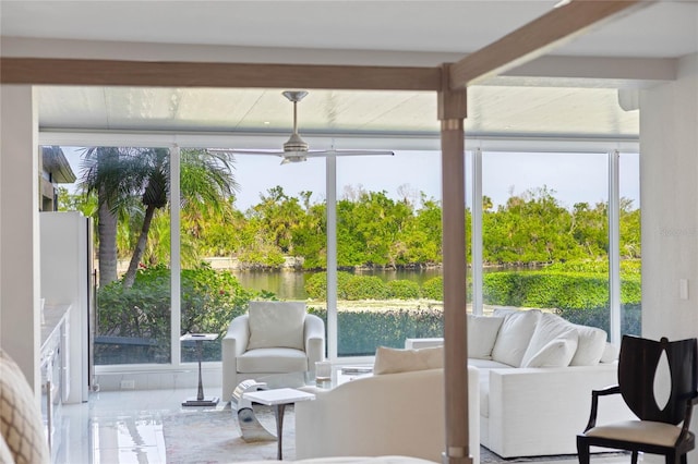 sunroom / solarium featuring a water view