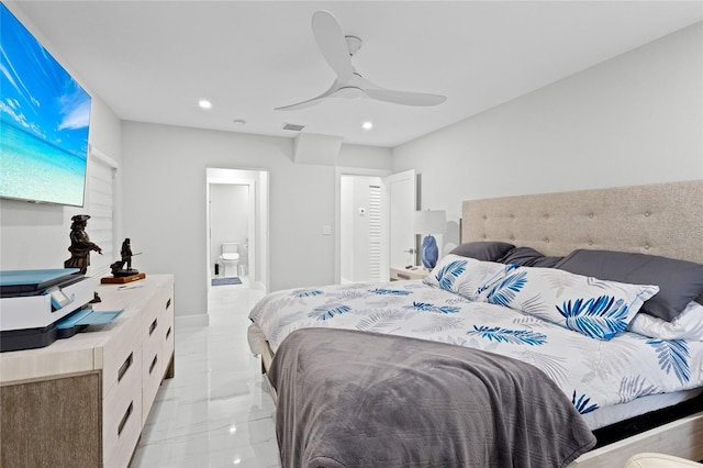 bedroom featuring ceiling fan and ensuite bath