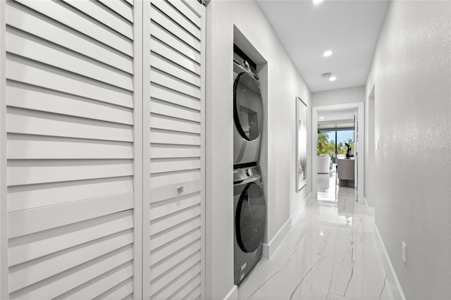 laundry room featuring stacked washer / dryer