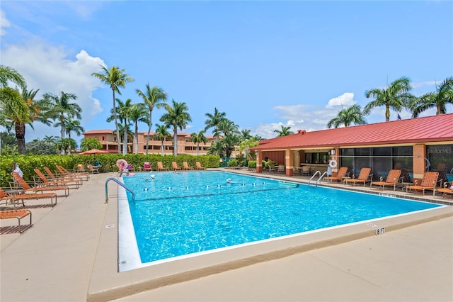 view of swimming pool featuring a patio