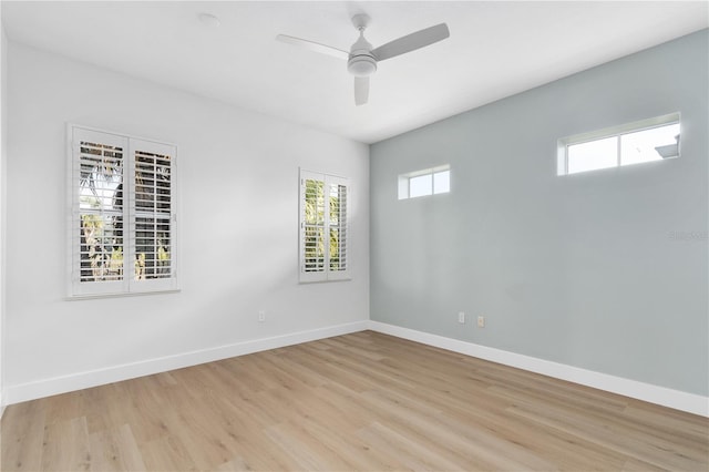 empty room featuring ceiling fan and light wood-type flooring