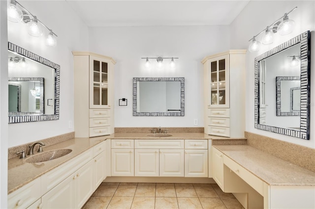 bathroom featuring tile patterned flooring and vanity