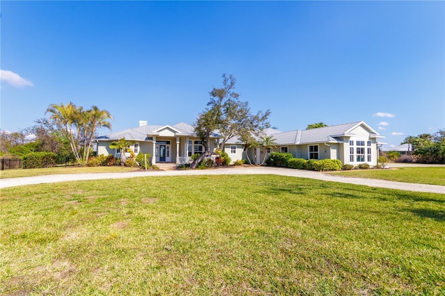 ranch-style home with a front lawn