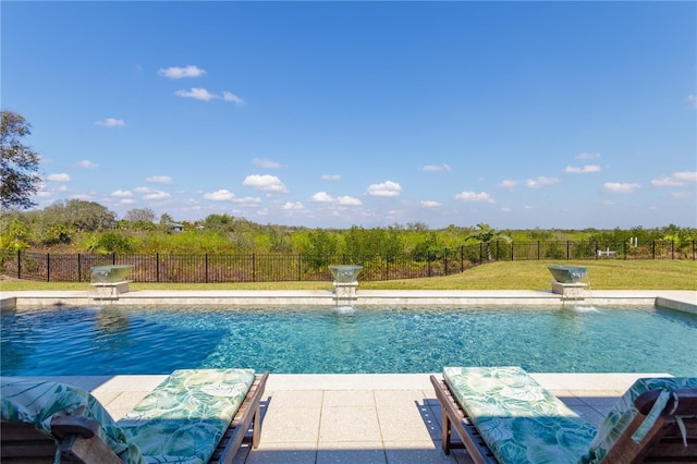 view of swimming pool featuring pool water feature and a lawn