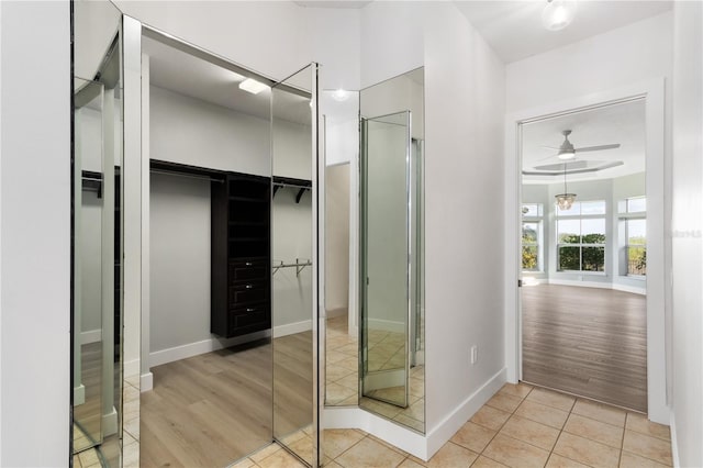 bathroom with tile patterned flooring and ceiling fan