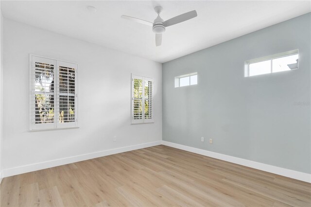 spare room featuring ceiling fan and light hardwood / wood-style floors