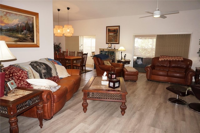 living room featuring ceiling fan and light wood-type flooring