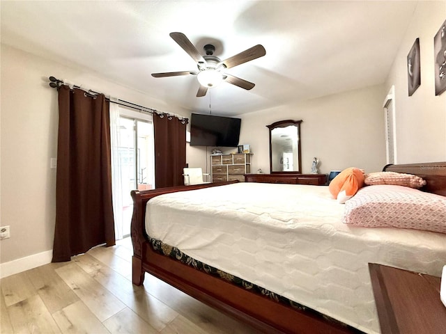 bedroom featuring ceiling fan and light hardwood / wood-style floors