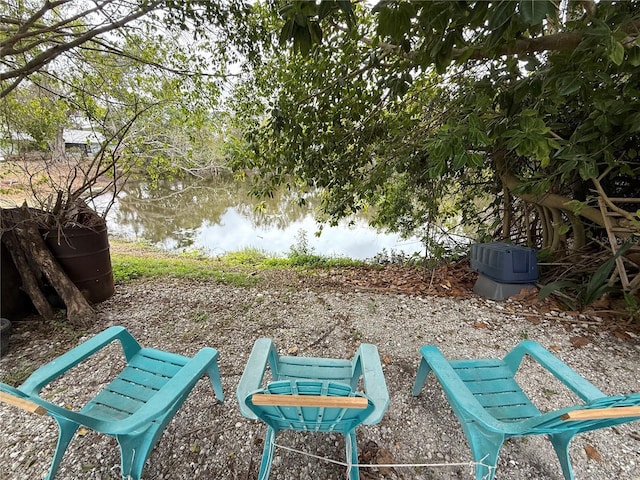 view of community with a water view