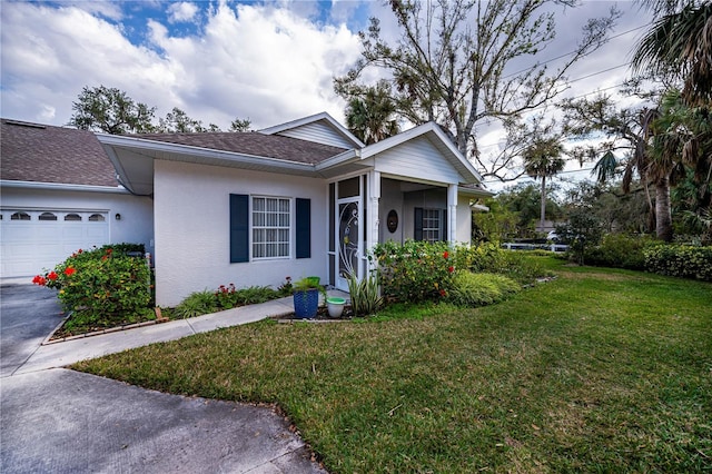 view of front of house featuring a garage and a front yard