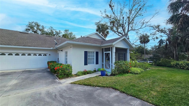 view of front of home featuring a garage and a front yard