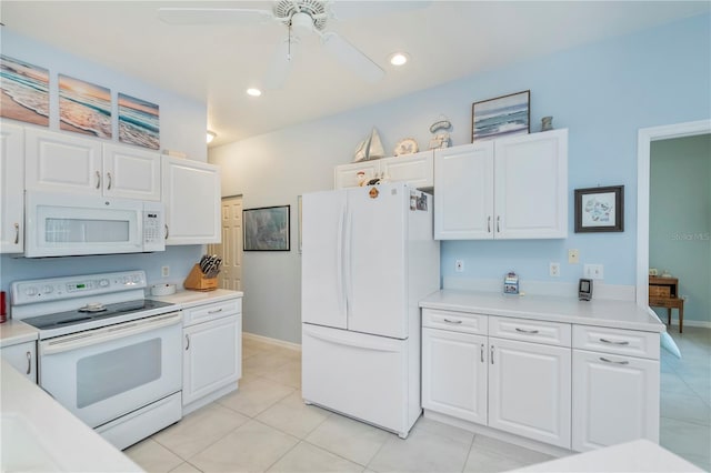 kitchen featuring light tile patterned floors, white appliances, white cabinets, and ceiling fan