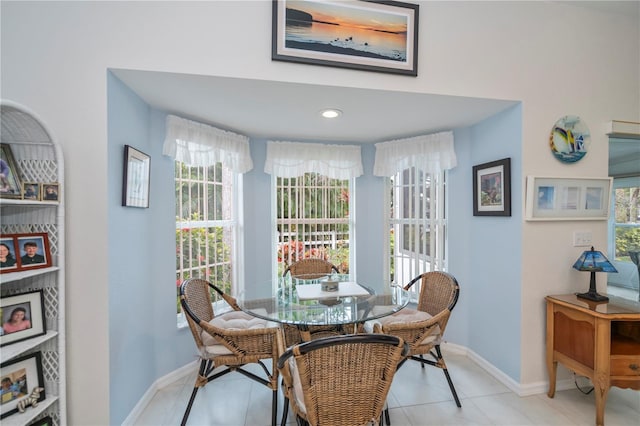 dining space featuring light tile patterned floors