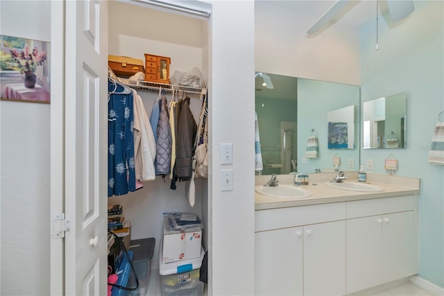 bathroom featuring ceiling fan and vanity