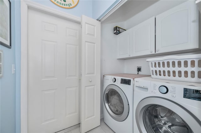 laundry area featuring cabinets and washer and dryer